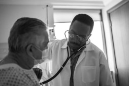 doctor examining patient